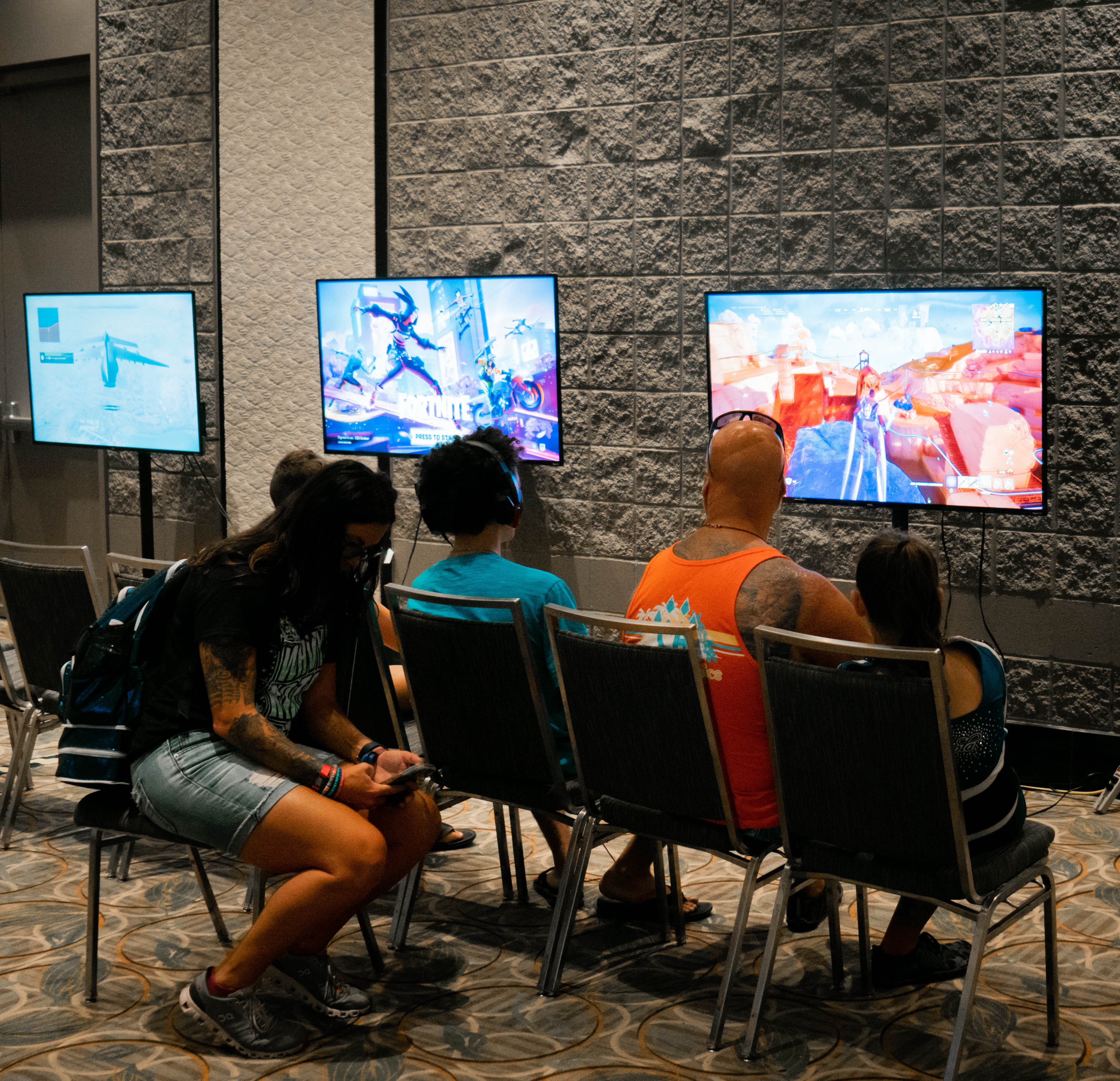 Family playing video games at BattleCity Esports Orlando, FL