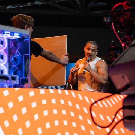 Tyler "Tyler1" Steinkamp entertains a fan on top of The Pyramid at Dreamhack Dallas 2023.