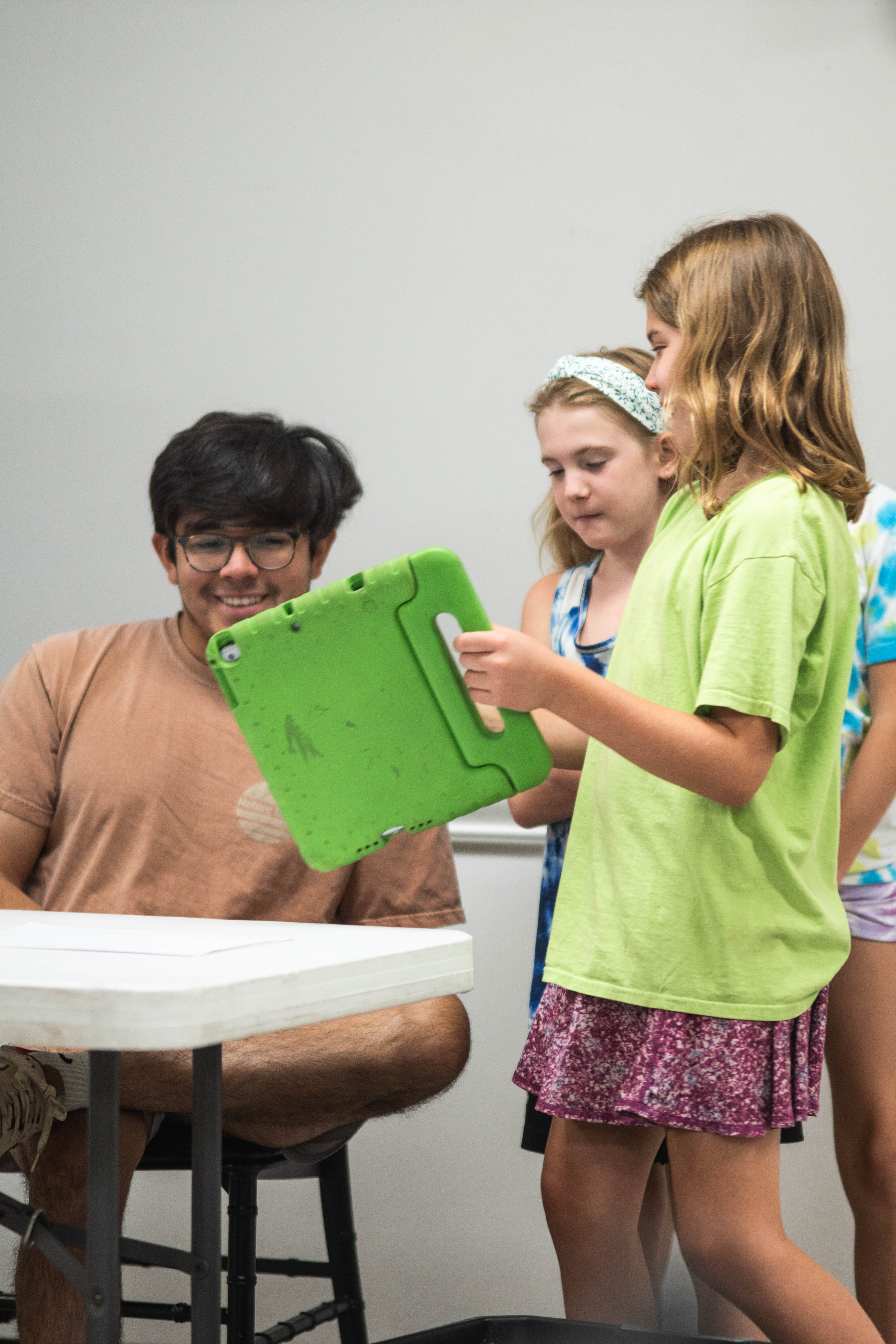 Techie Factor students show their ideas to instructor Isi Martinez