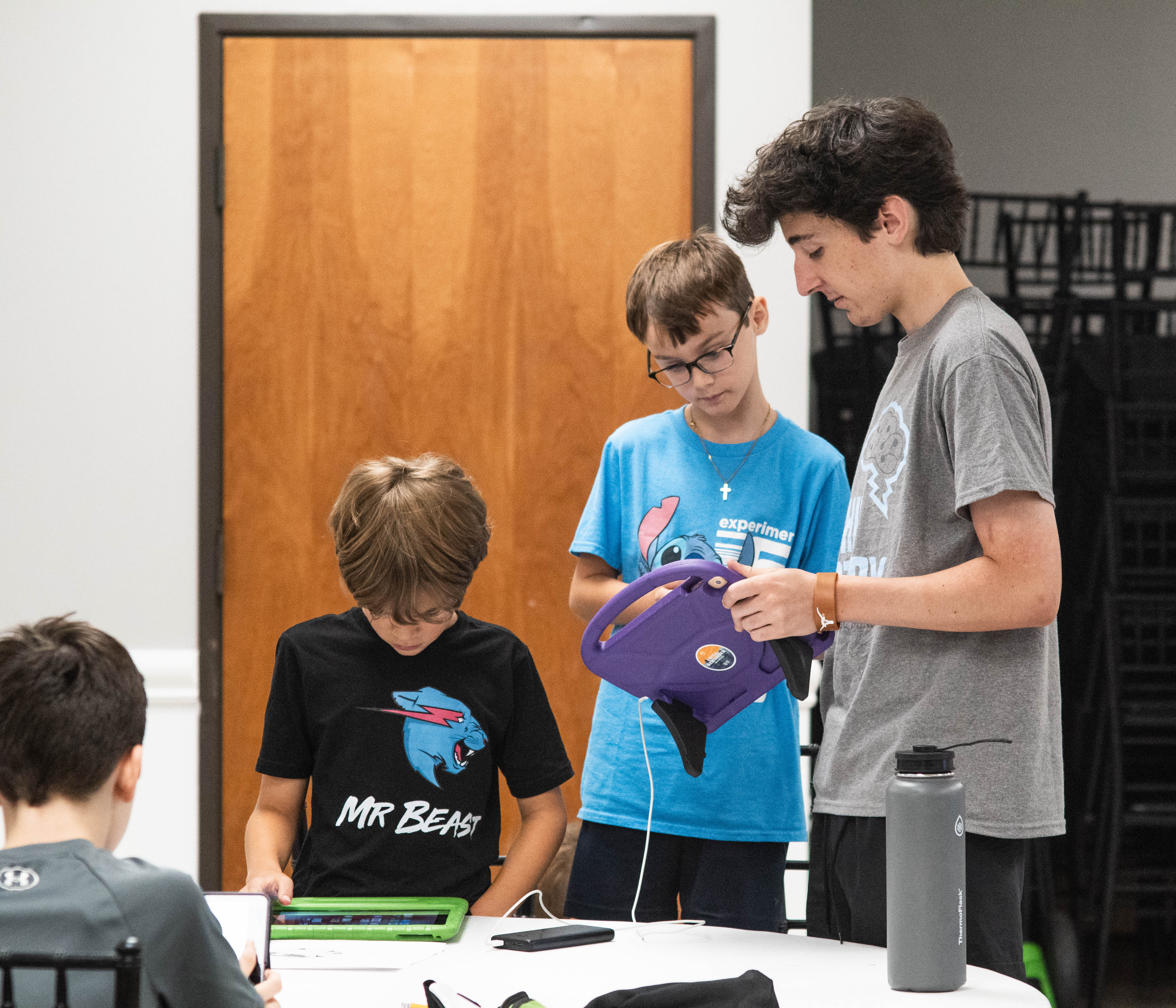 Instructor Nash DeHaven shows a student how to embed voice overs into his video.