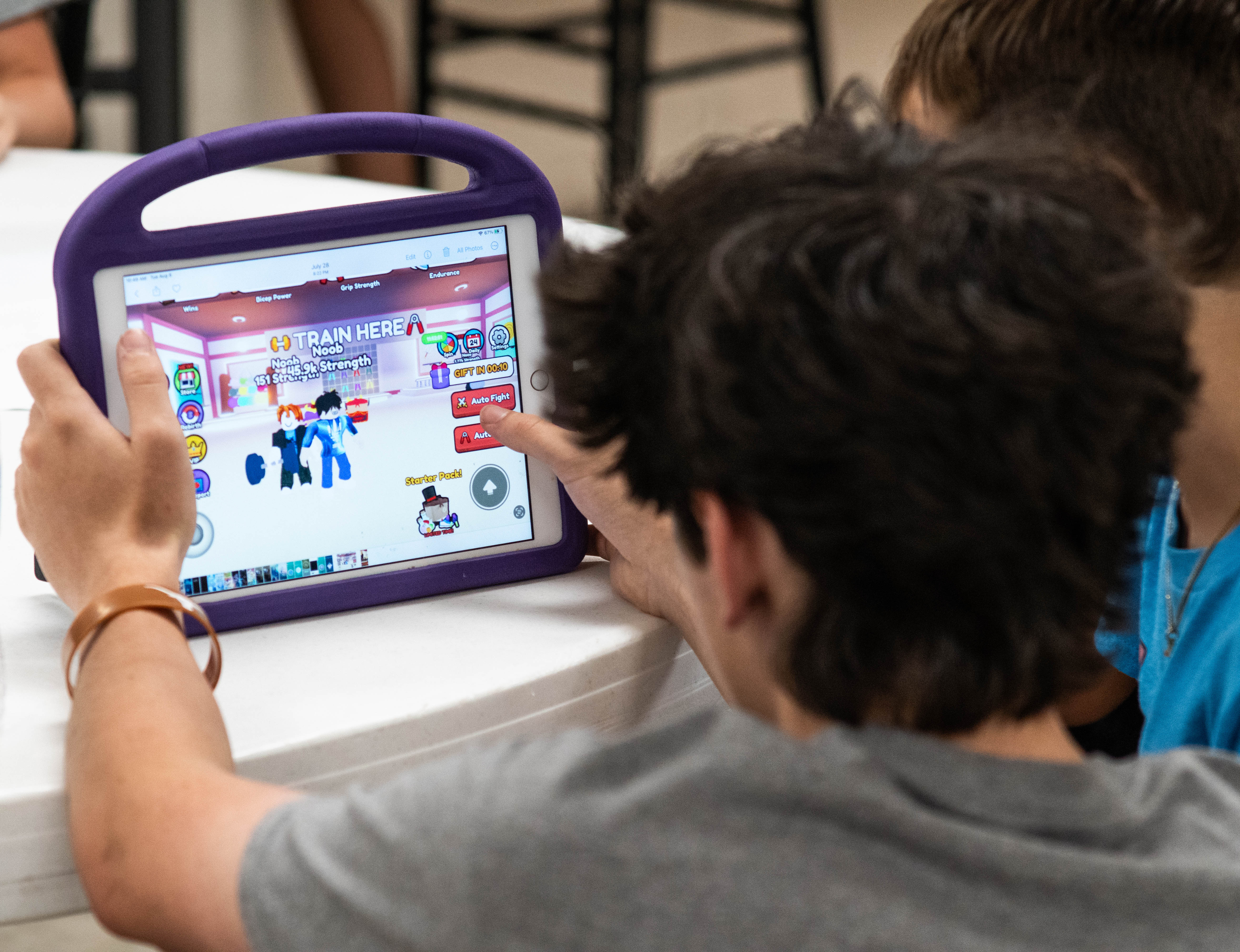 Instructor Nash DeHaven working with a student's gameplay. 