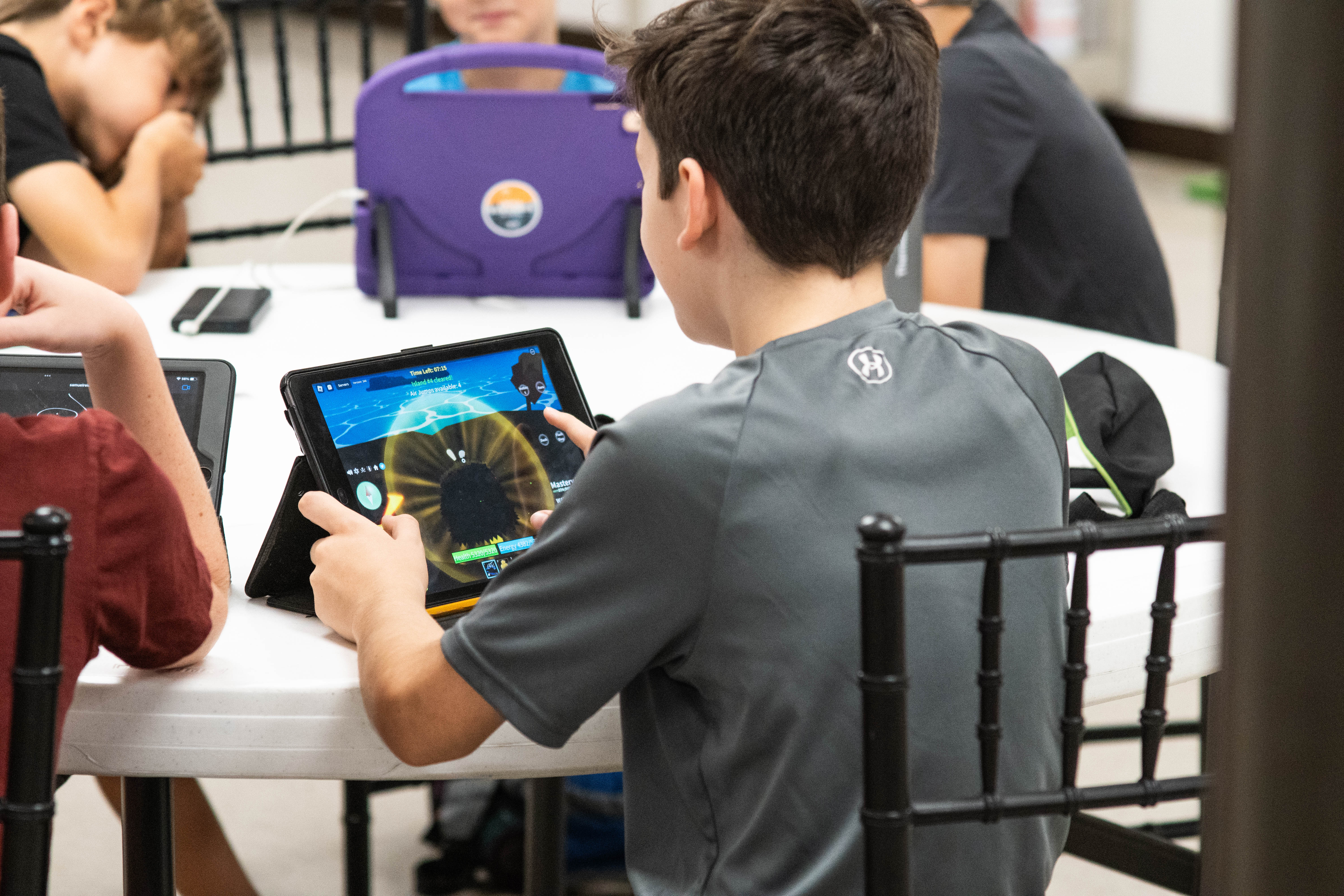 Techie Factory students look over their gameplay for their videos. 