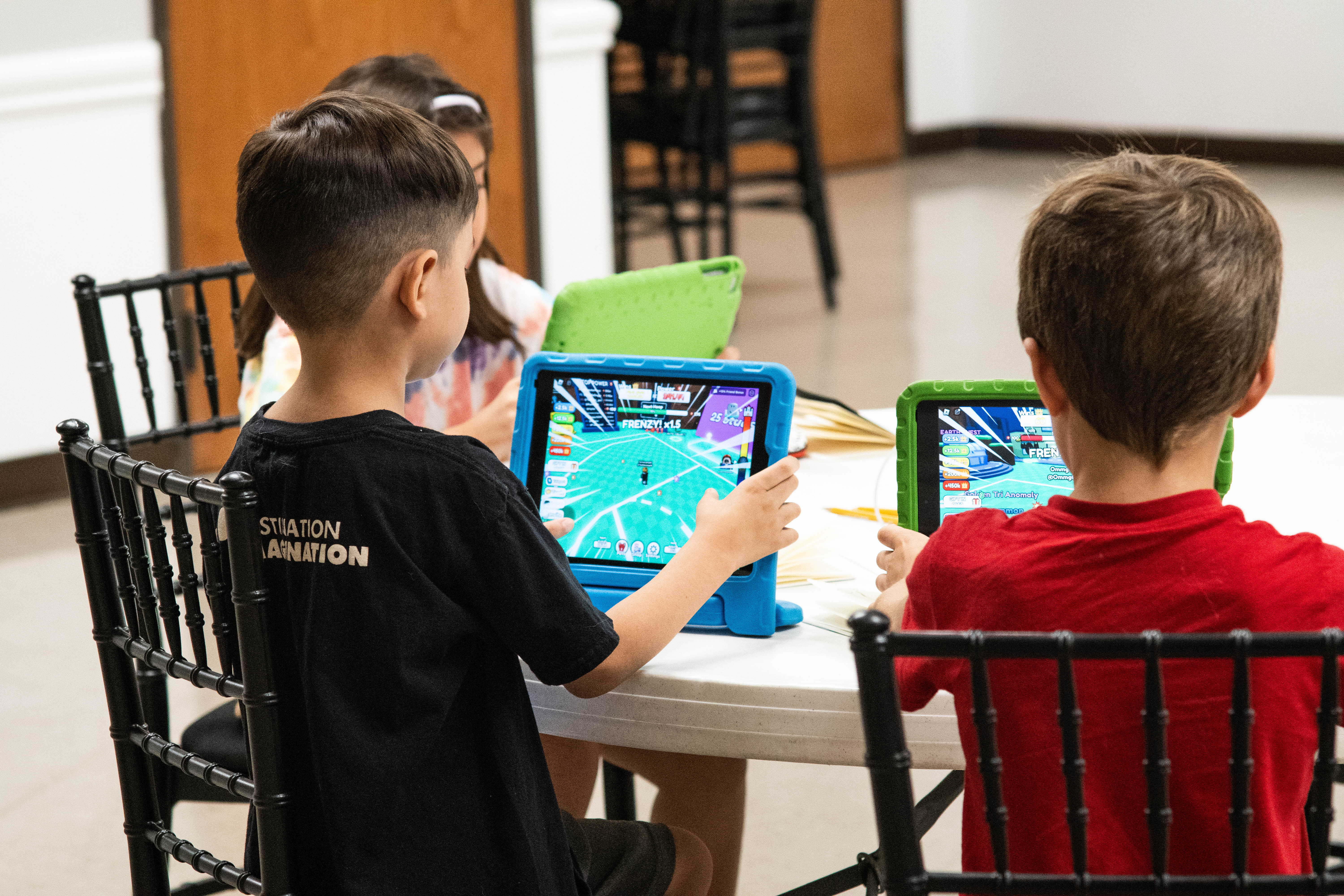 Techie Factory students look over their gameplay for their videos. 