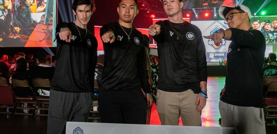 Members of Team IVsaken pose with check won by Ivan "Flurriously" Ortega-Nguyen. Photo credit Rachel Olsen-Cooper